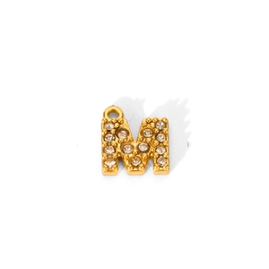 Detail of 18K gold plated letter M pendant with paved clear zircon stones for DIY necklace