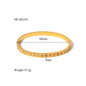 Detailed view of gold geometric square link bracelet with inset crystals and size specs
