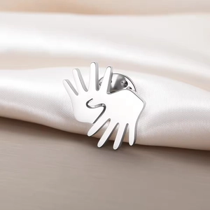 Silver stainless steel hand gesture brooch on white silk for sign language enthusiasts