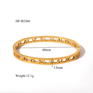 Detail view of hollow Roman numeral gold plated stainless steel bangle with dimensions