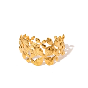 18K gold-plated stainless steel cuff bracelet featuring detailed hollow floral patterns