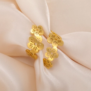 Close-up of golden cherry blossom open ring featuring intricate hollow petal craftsmanship