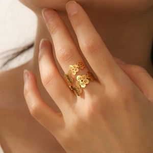 Adjustable golden cherry blossom open ring featuring multiple delicate floral petals