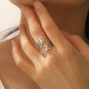 Polished silver hollow floral open ring with cherry blossom design for women