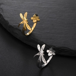 Adjustable dragonfly and flower open ring in gold and silver finish on slate rock