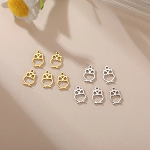 Detailed view of hollow owl charms in gold and silver for DIY jewelry making accessories
