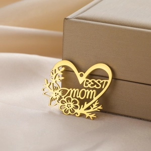 Golden heart-shaped BEST MOM pendant with hollow floral design and 18K gold plating finish