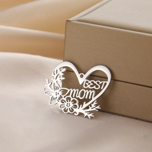 Heart-shaped hollow pendant with flower engraving and BEST MOM lettering in silver finish