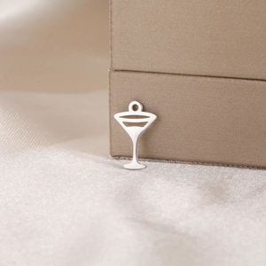 Macro view of a silver martini glass pendant charm for DIY jewelry making