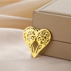 Hollow heart pendant in gold stainless steel with intricate face silhouette design