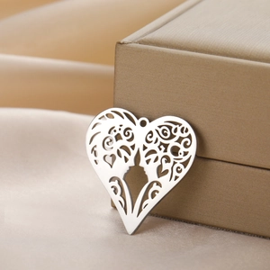 Hollow heart stainless steel pendant with intricate swirl patterns for jewelry making