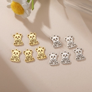 Detail view of 10 gold and silver stainless steel panda charms for DIY jewelry making