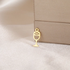 Detail of a minimalist gold wine glass pendant for DIY jewelry and bracelet making