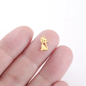 Macro view of a gold-plated stainless steel cat silhouette pendant for DIY jewelry