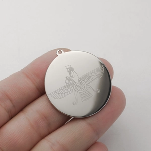 Detailed close-up of 18K gold-plated stainless steel Faravahar medallion pendant