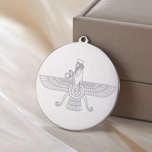 Silver Faravahar circular pendant in stainless steel displayed on silk with a gift box