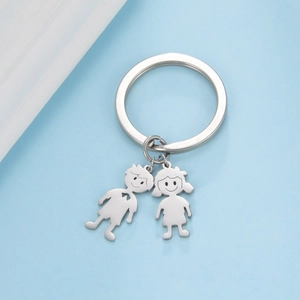 Polished stainless steel keychain featuring minimalist boy and girl cartoon pendants