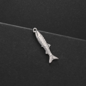 Close-up of a stainless steel tropical fish pendant with detailed scales for DIY jewelry