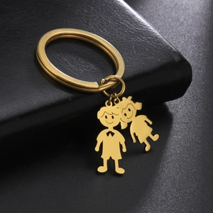 Polished gold stainless steel keychain with cute boy and girl cartoon charms on black leather