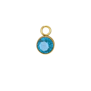 Detail view of light blue round birthstone pendant in gold bezel setting for DIY jewelry