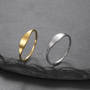 Minimalist gold and silver stainless steel signet rings with oval polished surface