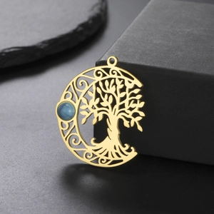 Macro detail of golden hollow life tree pendant with blue turquoise stone inlay