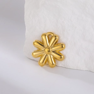 Detailed view of a golden daisy flower pendant with polished finish for DIY jewelry