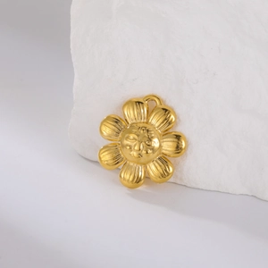 Detailed relief of a golden sun flower pendant with personified face and matte texture