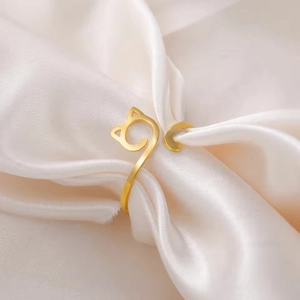 Minimalist cat ear open ring in polished gold finish with an adjustable stainless steel band