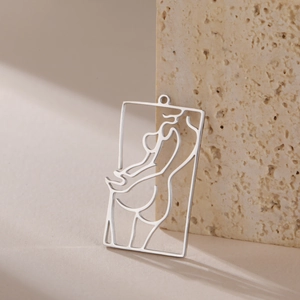 Detail of a minimalist rectangle hollow pendant featuring elegant female body line art