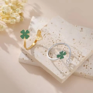Adjustable gold and silver clover open rings with green enamel and floral details