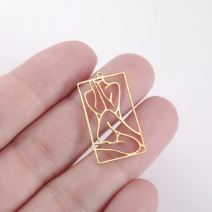 Detail of a rectangular hollow pendant featuring gold line art of a female silhouette