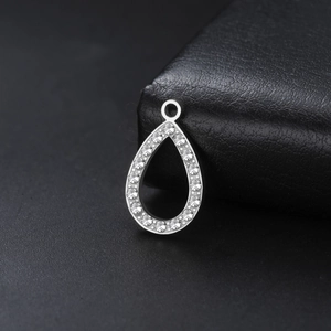 Polished stainless steel teardrop pendant with micro-pave cubic zirconia crystals