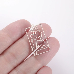 Macro shot showing the size of the hollow rectangle lady pendant in silver stainless steel