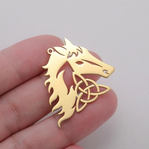 Detail of 18K gold horse head pendant with Celtic knot hollow design and top loop