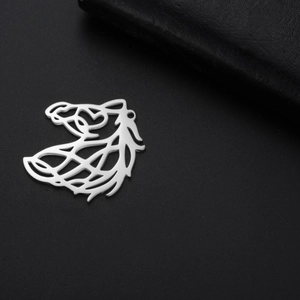 Macro shot of silver hollow horse head pendant on textured black leather background