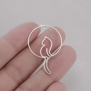 Detailed macro view of minimalist hollow cat pendant for DIY jewelry making