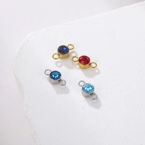 Close-up of sparkling rhinestone connector charms in gold and silver plating