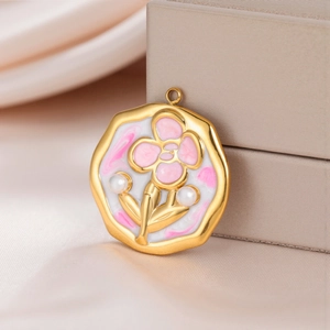 Detailed close-up of floral enamel pendant with pearls on luxury satin background
