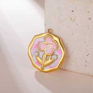 Floral enamel pendant with pearls and gold irregular rim on a natural stone base