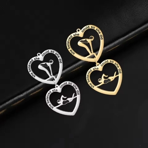 Inspirational heart-shaped swimmer pendant with she believed she could so she did engraving