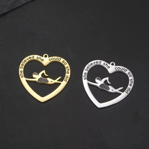 Inspirational heart pendant with a swimmer silhouette in gold and silver finish