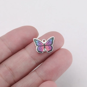 Close-up of a colorful butterfly pendant made of stainless steel for DIY jewelry making