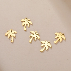 Detailed view of five golden stainless steel palm tree charms for DIY jewelry crafting