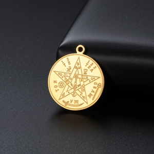 Detail of gold stainless steel Solomon pentagram pendant with fine esoteric engravings
