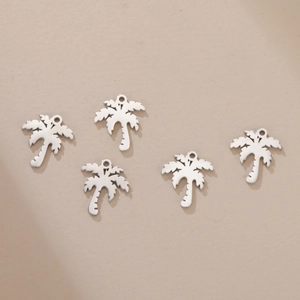 Detailed view of five silver tropical palm tree charms for DIY jewelry making accessories