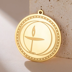 Polished gold stainless steel burning chalice pendant with decorative star border