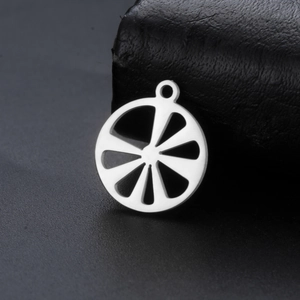 Macro shot of silver hollow lemon slice pendant made of durable stainless steel for DIY