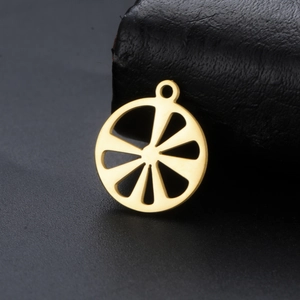Macro shot of gold hollow lemon slice pendant with ring for DIY jewelry making