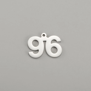 Close-up of polished stainless steel number 96 pendant for DIY jewelry making